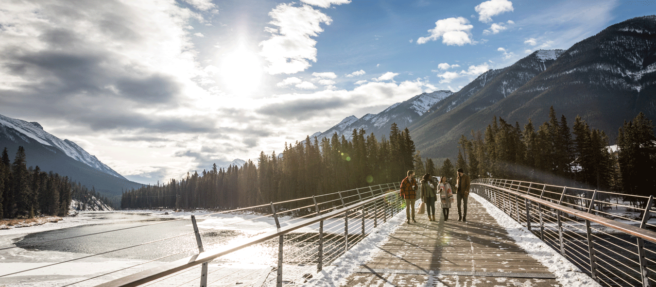 Group of people crossing the bridge in banff
