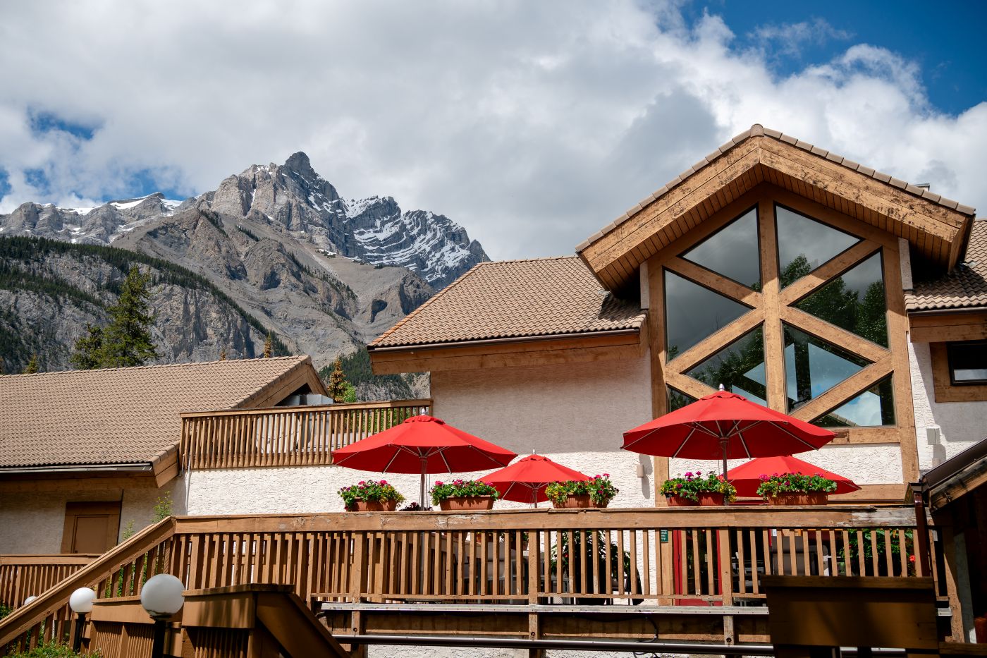 Breathtaking Cascade Mountain views from the sunny outdoor dining patio at Alpha Bistro in Banff.