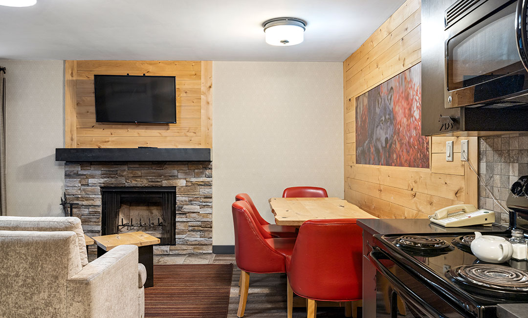 Twobedroom-wolf-condo Dining space and fireplace